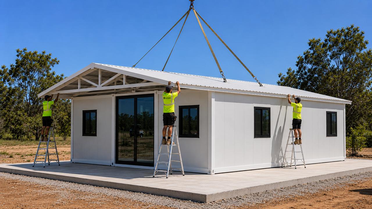 FlexiHomes team installing gable roof on expandable container home